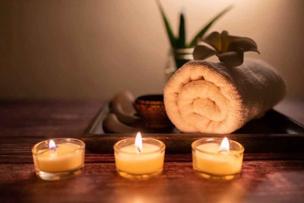 Candles and a rolled towel set out ready for a facial in the Verwood studio